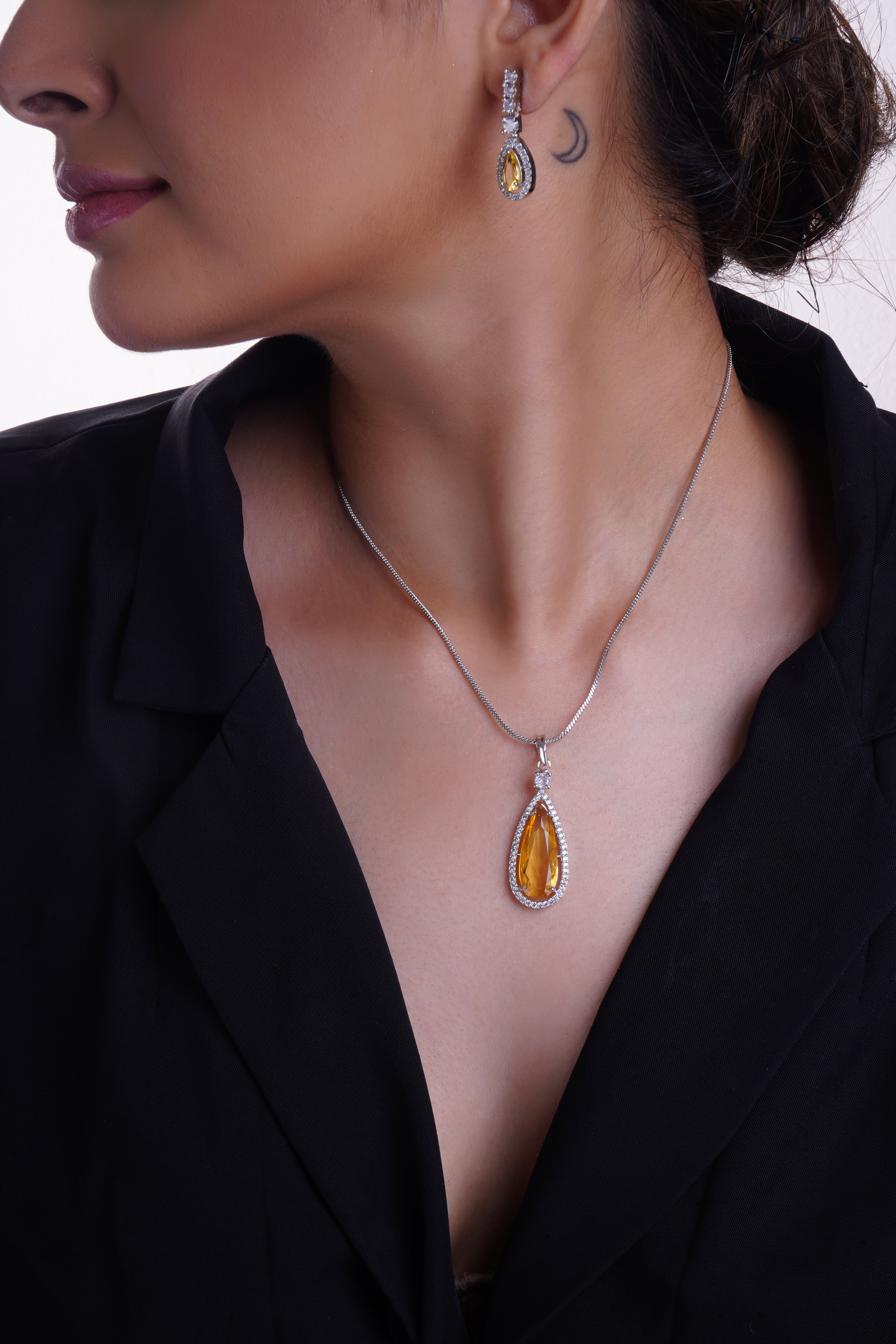 Rhodium Plated yellow Sapphire glass Stone Studded Pendent Set.