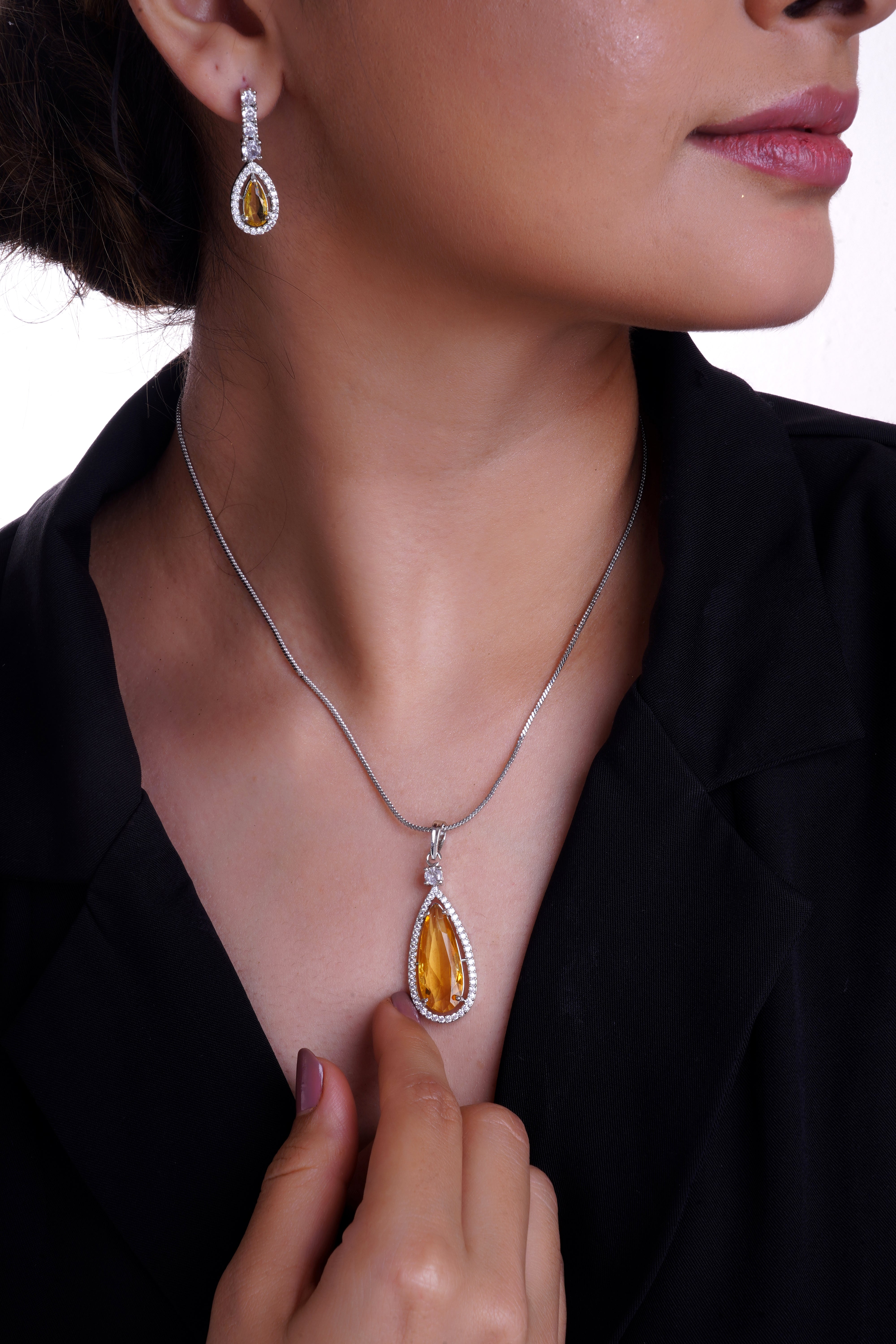 Rhodium Plated yellow Sapphire glass Stone Studded Pendent Set.